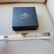 Prada women's leather belts with triangle logo buckle - sleek and stylish
