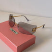 Miu Miu MU 10WS Rimless Shield Sunglasses